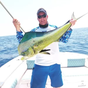 Grandslam Charters captain holding a dorado caught on a fishing charter in Fujairah UAE