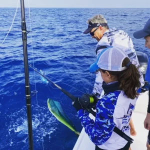 Child catching Dorado on fishing charter in Fujairah UAE