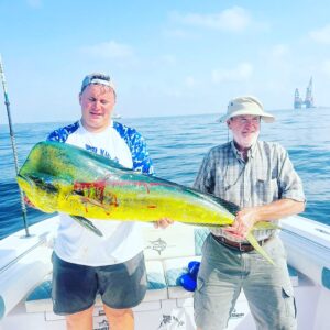 Grandslam charters captain and a guest holding a large dorado caught on a fishing charter in Fujairah UAE