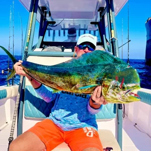 Guest showing off large dorado caught on fishing charter in Fujairah UAE