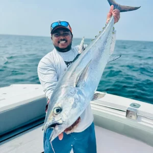 Grandslam Charters captain holding a large longtail tuna caught on a fishing charter in Fujairah UAE