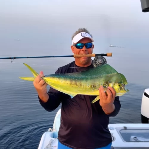 Grandslam captain with dorado caught on fishing charter in Fujairah UAE